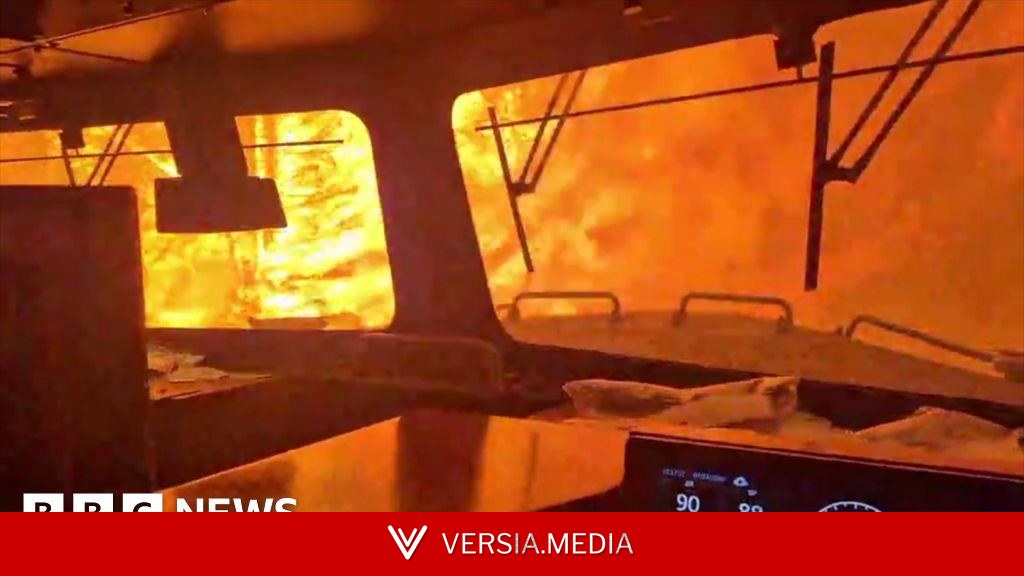 Dramatic video shows wildfire surround freight train in Canada